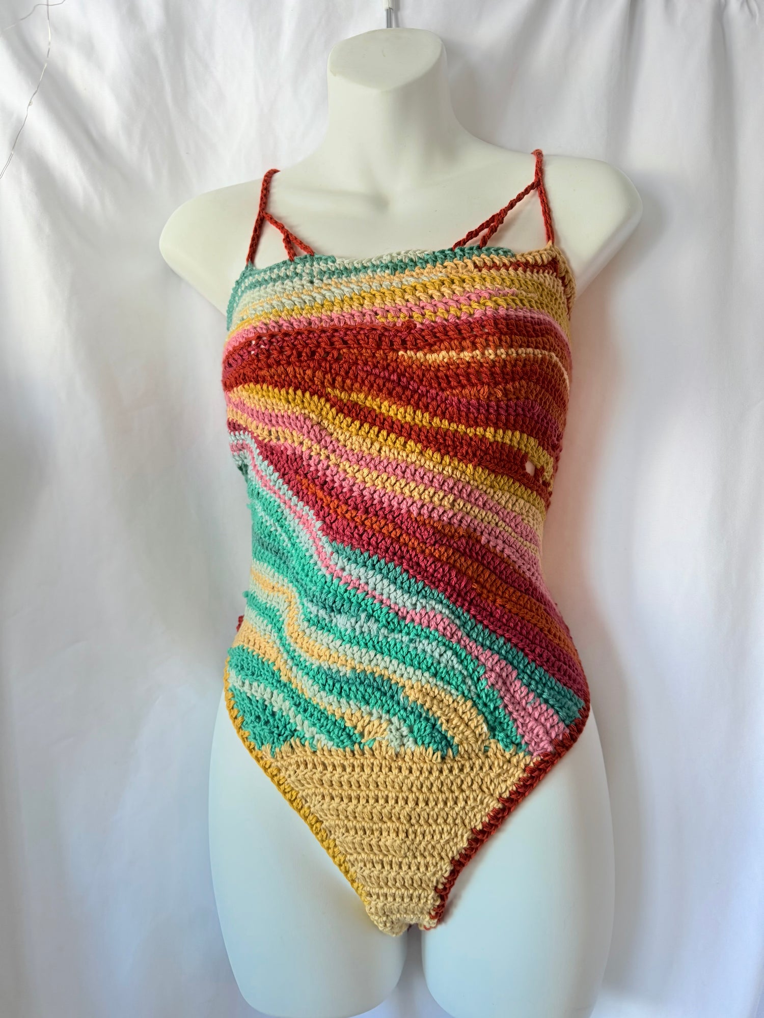 Handmade crochet festival bodysuit in organic cotton.