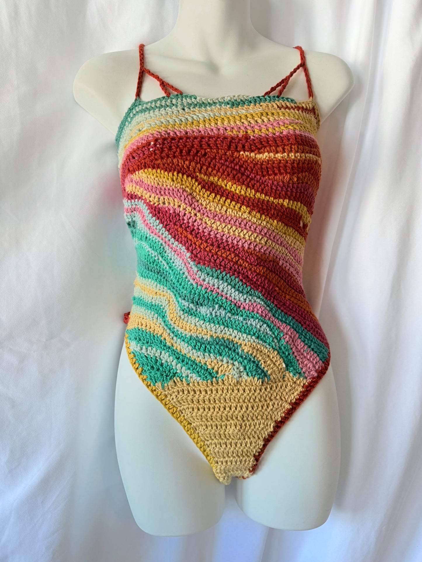 Handmade crochet festival bodysuit in organic cotton.