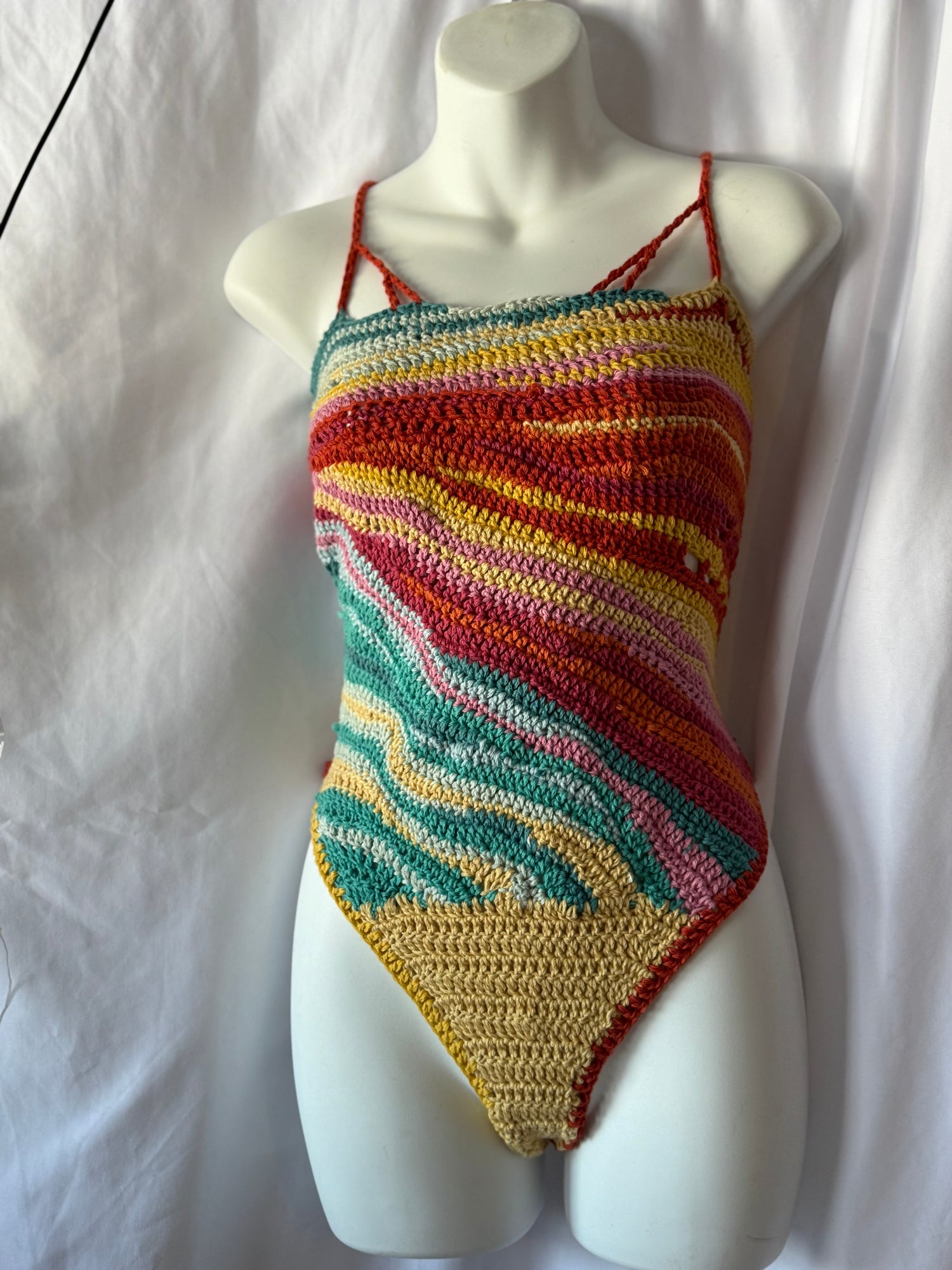 Handmade crochet festival bodysuit in organic cotton.